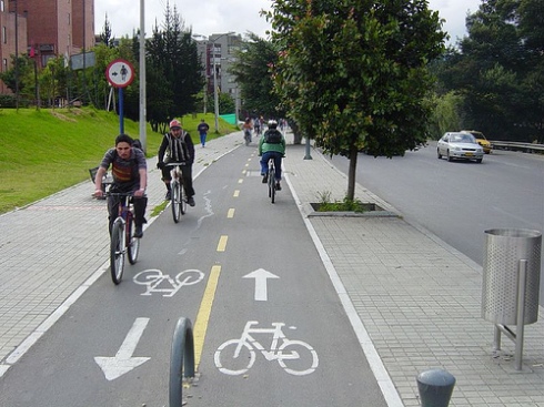 Protected bike lane (cycle track) in Bogota, Colombia.  From https://cbuscyclechic.wordpress.com.